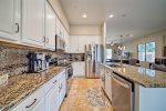 Large open kitchen with granite counter tops and stainless steel appliances